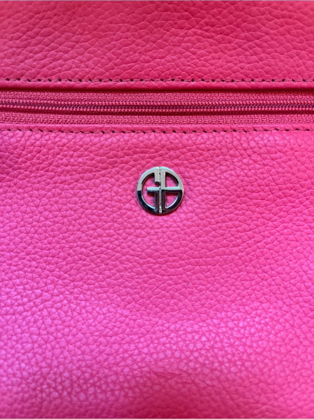 Giani Bernini genuine leather wristlet in a bright pink/fuchsia pebbled leather.
